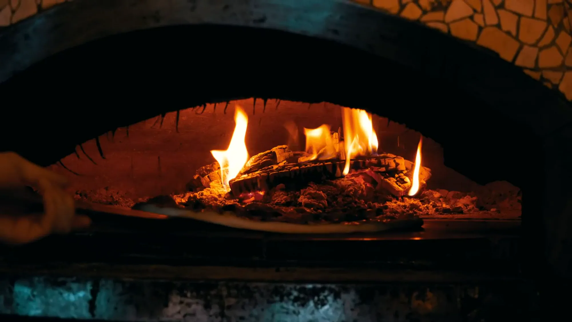 Flames inside the wood-fired oven