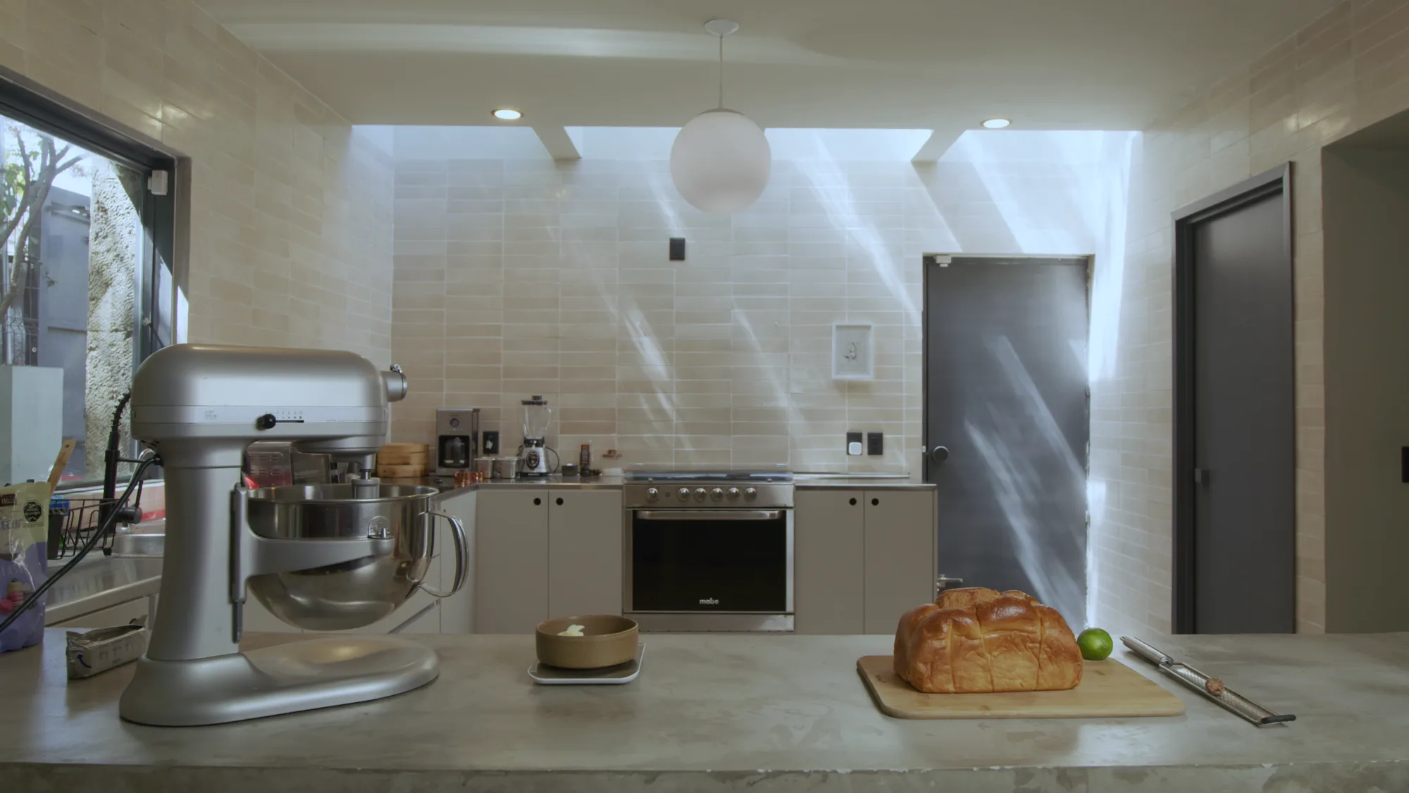 A bright modern kitchen with stone counters